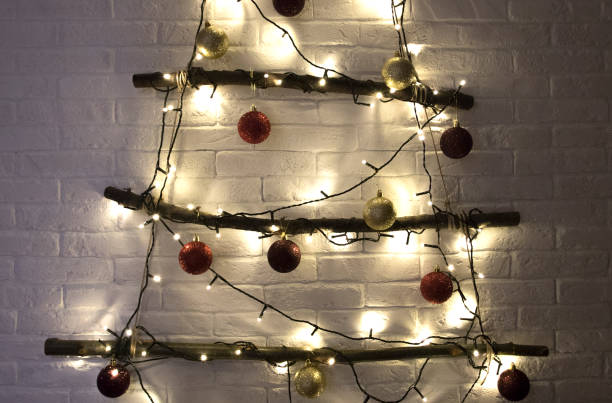 istock Christmas tree with xmas toys, balls and lights, handmade 1207276084