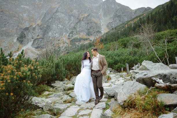 istock Beautiful couple walking among rocks 1207276196
