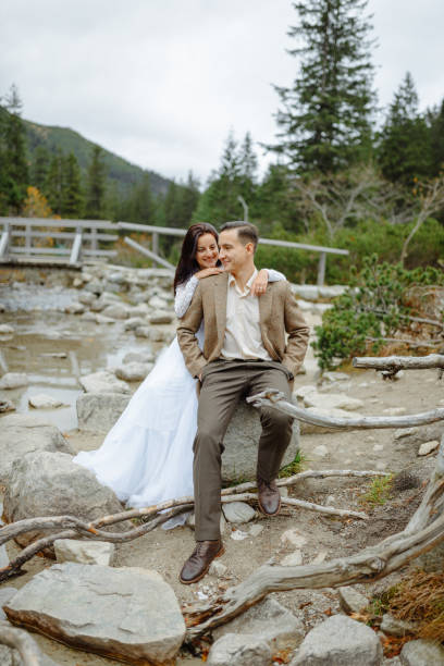 istock Beautiful couple walking among rocks 1207276357