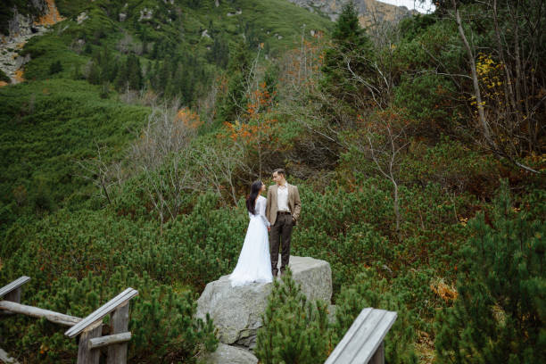 istock Beautiful couple walking among rocks 1207276411
