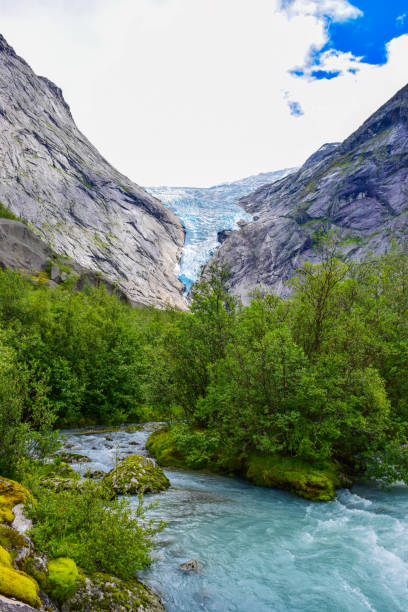 istock The Brikdalsbreen glacier in Norway. The lake with clear water. 1207277552
