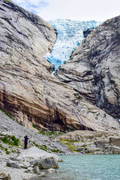 istock The Brikdalsbreen glacier in Norway. The  Briksdalsbrevatnet lake with clear water. 1207277568