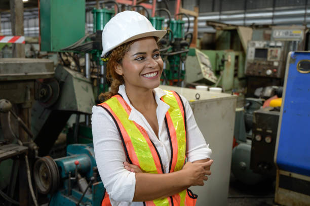 portrait mixed race female engineer working in factory area. portrait mixed race female engineer working in factory area. trainee training computer designer stock pictures, royalty-free photos & images