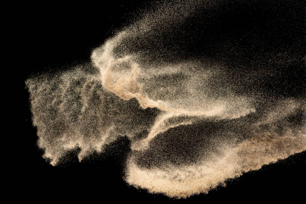 istock Brown colored sand splash.Dry river sand explosion isolated on black background. Abstract sand cloud. 1207280930