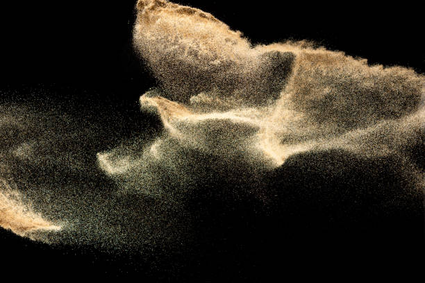 istock Brown colored sand splash.Dry river sand explosion isolated on black background. Abstract sand cloud. 1207280932