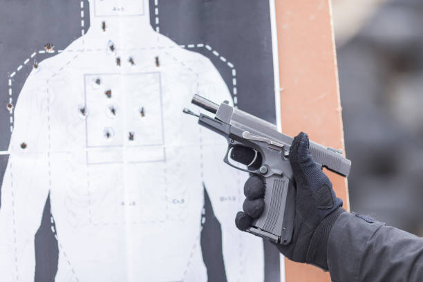 police, army and border police gun training. firing weapons and pistols. gun shooting exercise. detailed shots of gun, bullets and shells. gun laws stock pictures, royalty-free photos & images