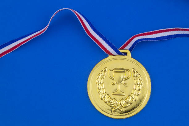 istock Gold medal on blue background 1207281689