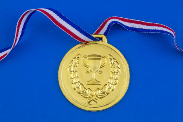 istock Gold medal on blue background 1207281698