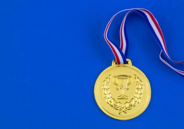istock Gold medal on blue background 1207281719