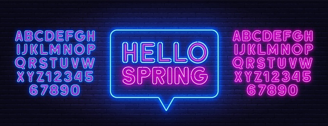 Hello Spring neon lettering on brick wall background .