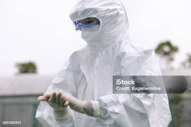 Cdc Staff With Protective Workwear Stock Photo - Download Image Now - Protective Workwear, Coveralls, Clean Suit