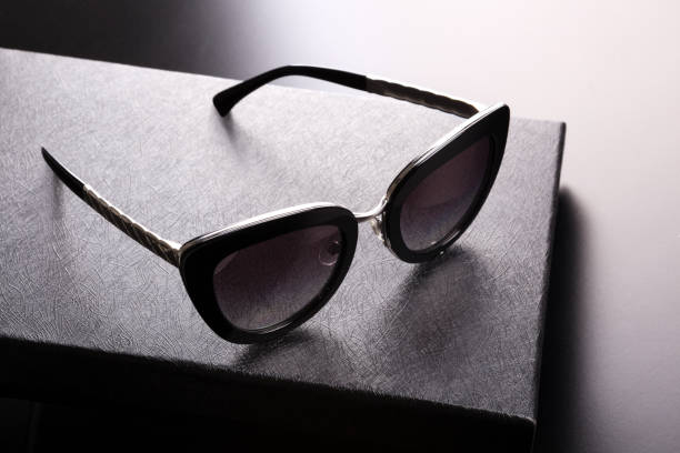 istock Fashionable sunglasses on a black box. 1207285397