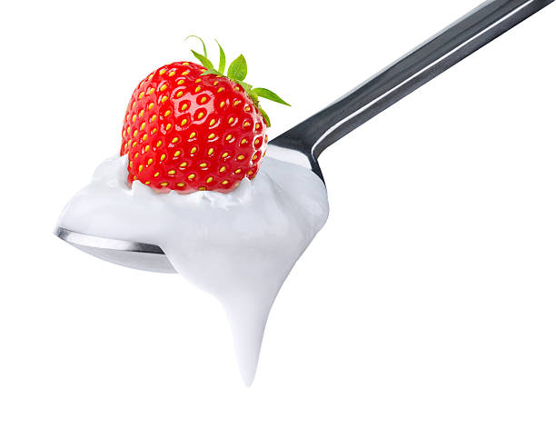 istock Spoon of yogurt with strawberry on top 120728579