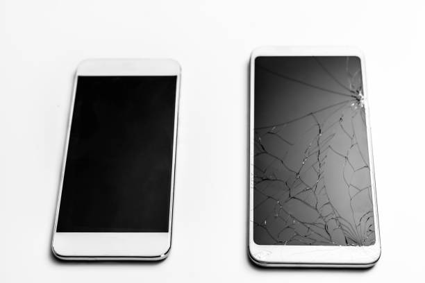 istock Two mobile phone, one with damaged screen, other, white background 1207286741