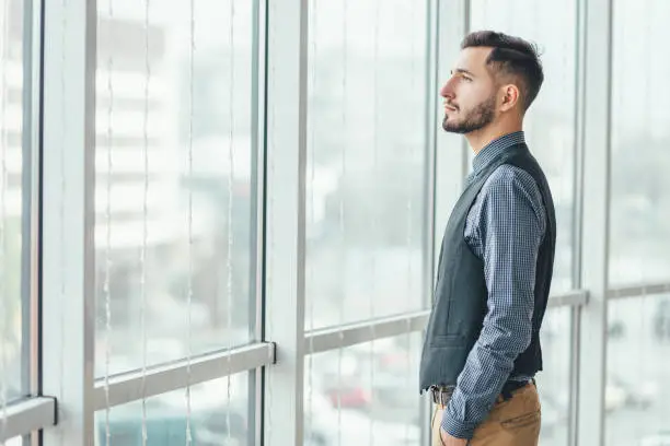 Photo of Confident businessman that looks for the future and the best perspectives for his business.