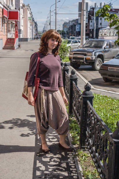 istock Girl in the city 1207288544