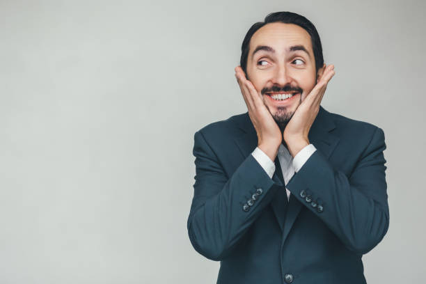 istock Funny comic businessman makes grimace, after all day working. 1207289666