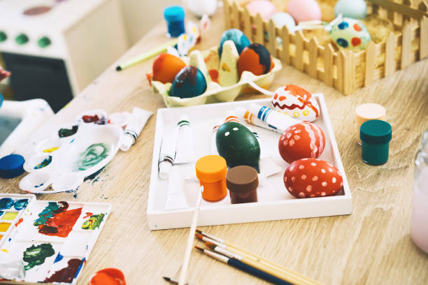 istock Happy Easter! Painting eggs. Paints, felt-tip pens, decorations for coloring eggs for holiday. Creative background. 1207290079
