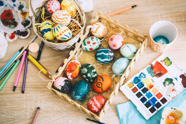 Happy Easter! Painting eggs. Paints, felt-tip pens, decorations for coloring eggs for holiday. Creative background.