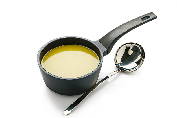 istock Broth in a cooking pan isolated on white background 1207293023