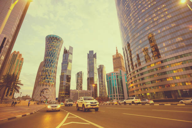 Modern skyscrapers in financial district at twilight in Doha, Qatar Doha, Qatar - November 24, 2019 : Futuristic modern skyscrapers in financial district at twilight in Doha, Qatar on November 24, 2019. qatar emir stock pictures, royalty-free photos & images