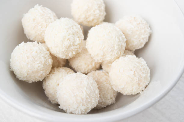 istock Sweets with almonds and coconut in a plate closeup 1207295711