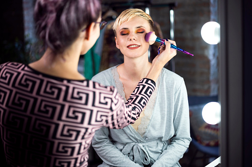 Young woman on a professional makeup treatment.