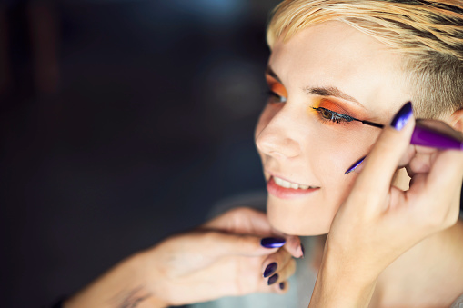 Young woman on a professional makeup treatment.