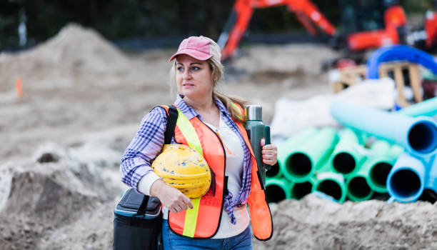 istock Mature woman working at construction site, on break 1207296713