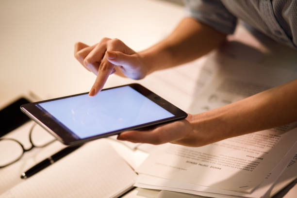istock Close up of unrecognizable businesswoman using digital tablet 1207297043