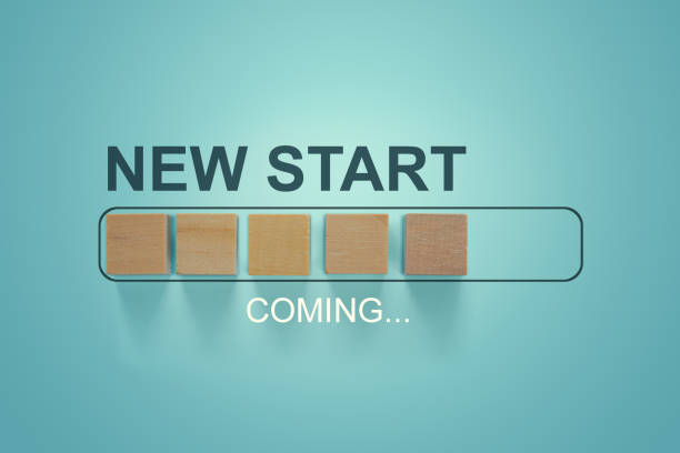 istock Wooden blocks with the word NEW START coming in loading bar progress. 1207298218