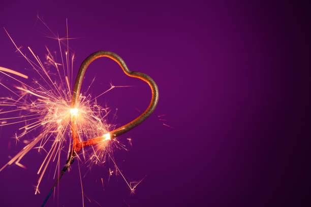 istock Brightly burning sparkler heart shaped 1207298762