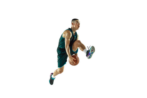 istock Young basketball player training isolated on white studio background 1207299912