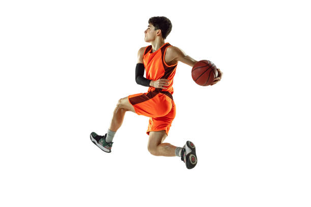 istock Young basketball player training isolated on white studio background 1207299916