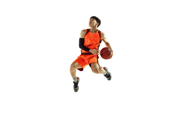 Young basketball player training isolated on white studio background