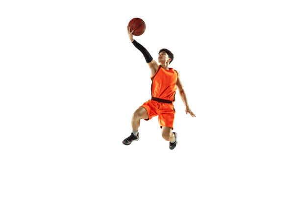 istock Young basketball player training isolated on white studio background 1207299925