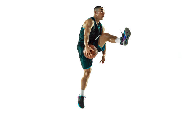 istock Young basketball player training isolated on white studio background 1207299932