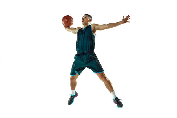 istock Young basketball player training isolated on white studio background 1207299938