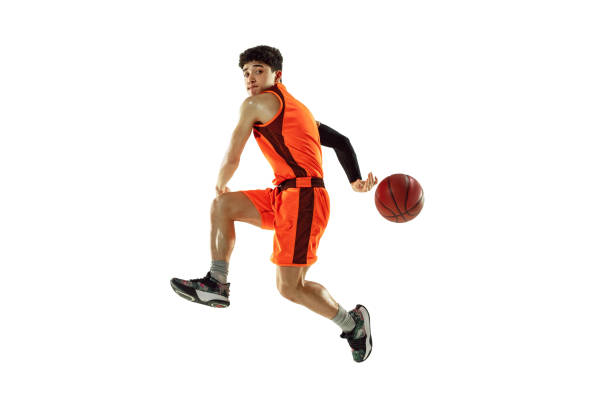 istock Young basketball player training isolated on white studio background 1207299951