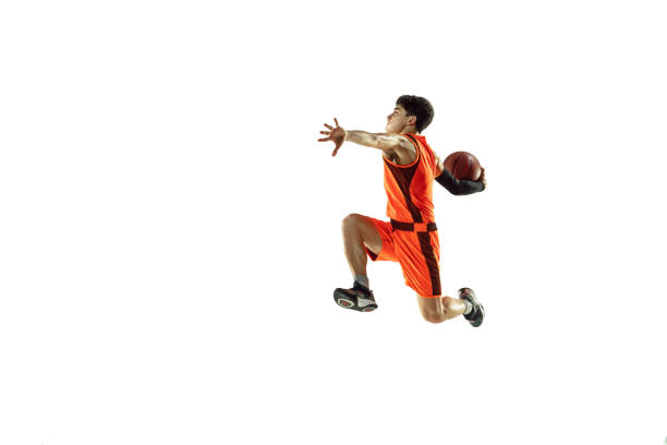 istock Young basketball player training isolated on white studio background 1207299974