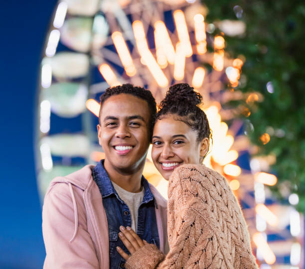 istock Young couple at county fair 1207300040