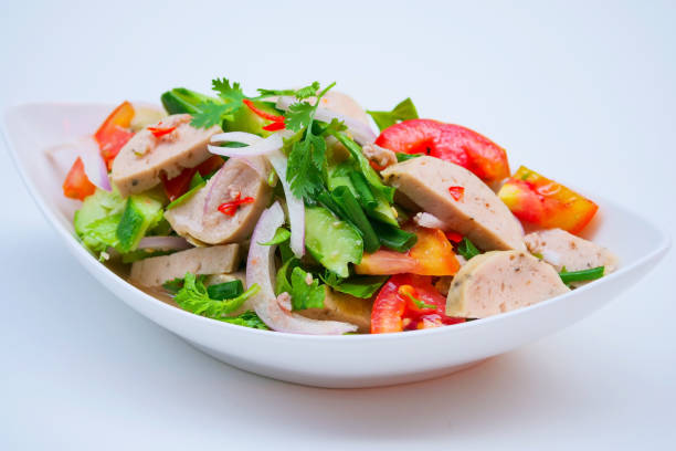 Delicious spicy vietnamese sausage salad with vegetable. stock photo