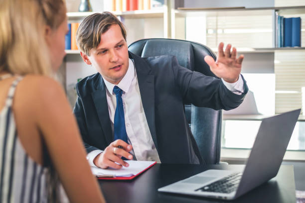 istock manager discussing work schedule plan or monthly target planing with his colleagues at meeting, business teamwork and partnership concept. 1207301466
