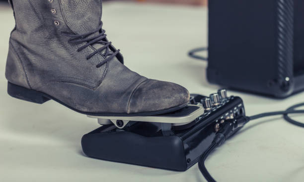 istock Close-up of musician using wah-wah pedal. 1207302978