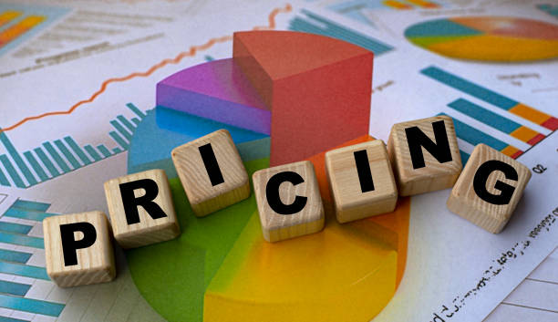 istock concept word pricing on cubes against the background of the graph 1207303066