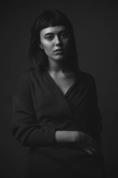 istock Young woman posing in studio 1207303139