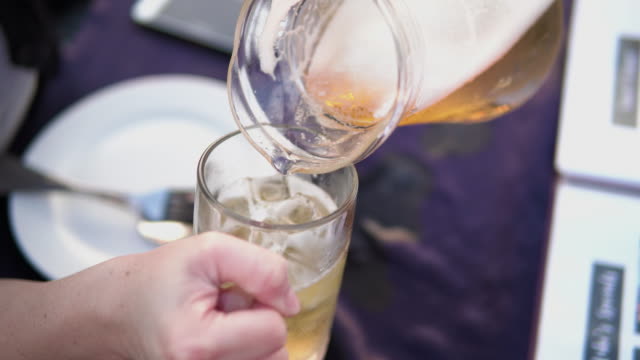 Beer pouring into a glass.