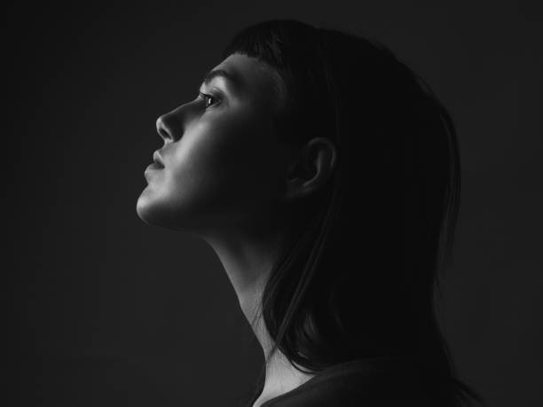 istock Young woman in profile 1207303430
