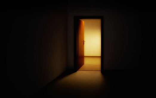 Light entering through open doors in dark room