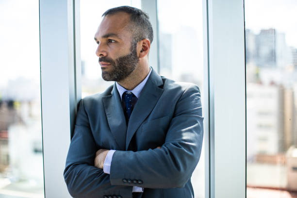 istock Confident businessman in his bright office 1207305126